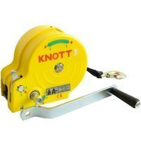 Handlier KNOTT 450 kg met een gele behuizing en een band