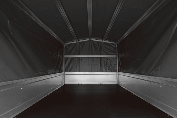 Enkelassige aanhanger 200x125 UNITRAILER GARDEN 201 KIPP met H-800 frame en grijze afdekking