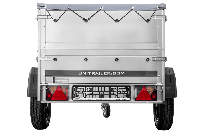Unitrailer GARDEN TRAILER 150 KIPP met een steunwiel, twee zijkanten en een grijze platte afdekking op een frame
